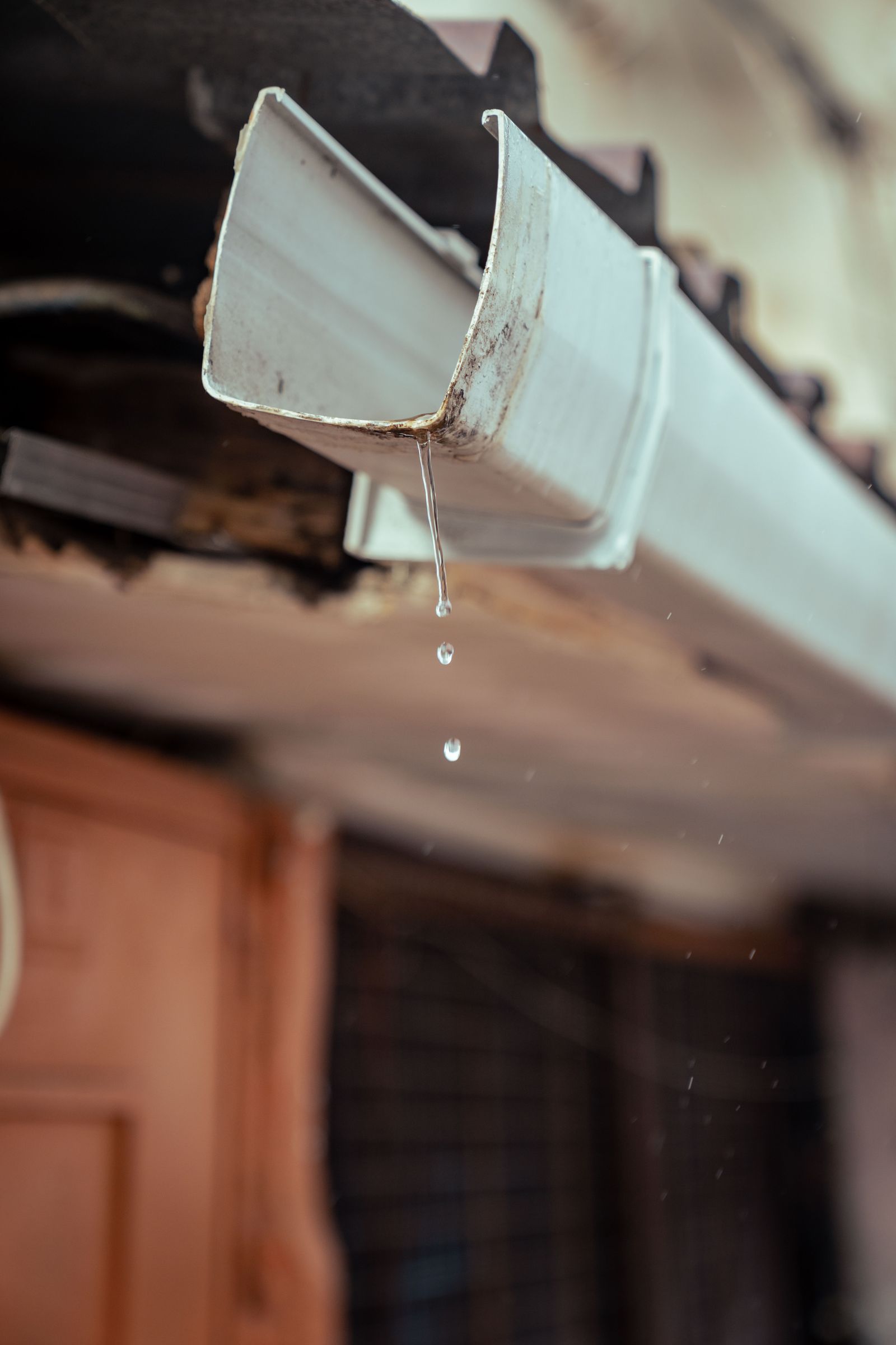 Water overflowing from a blocked gutter