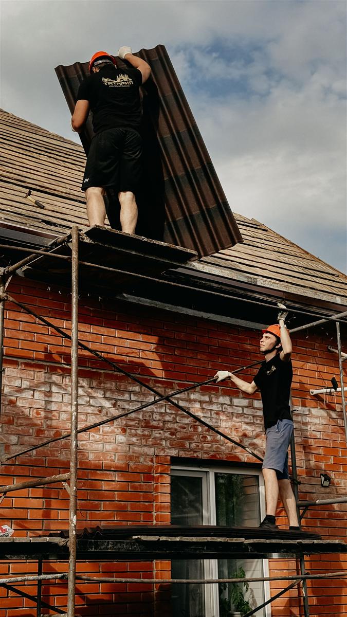 Roof replacement in progress on a house