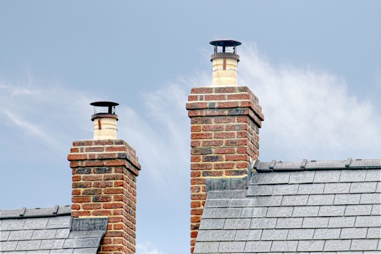 Metal flashing fitted around a chimney