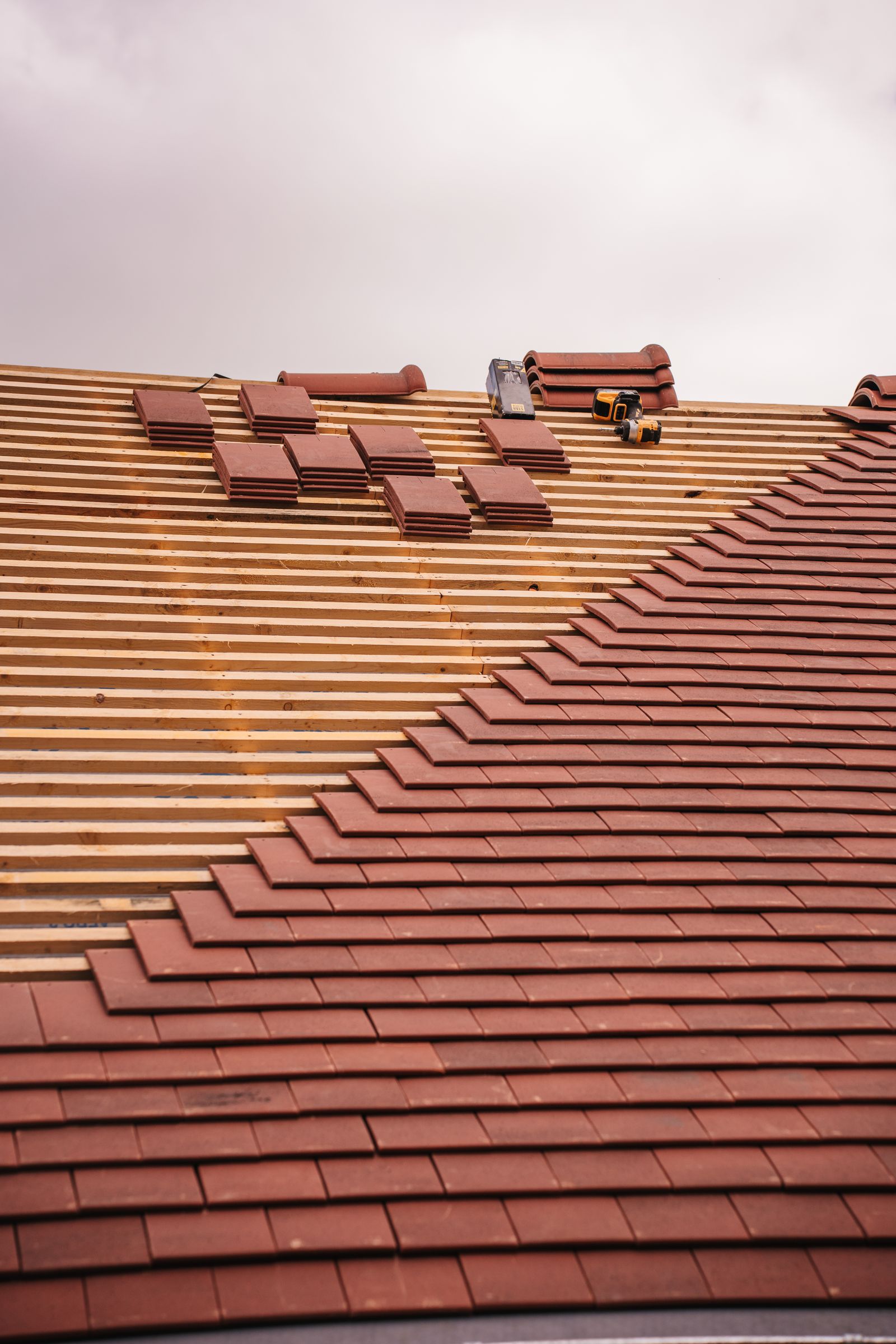 New shingle roof being installed on a house